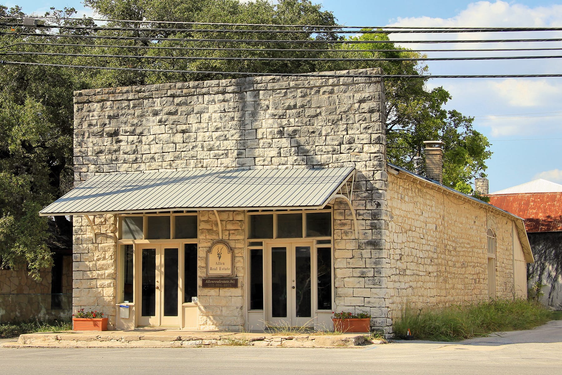 Historic limestone Patterson Building on Mercer Street in Dripping Springs, Hays County