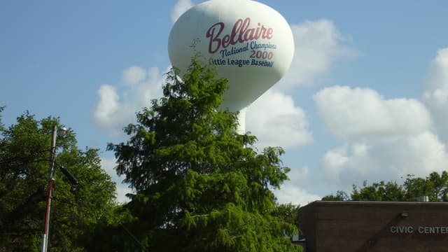 The Bellaire water tower above the trees
