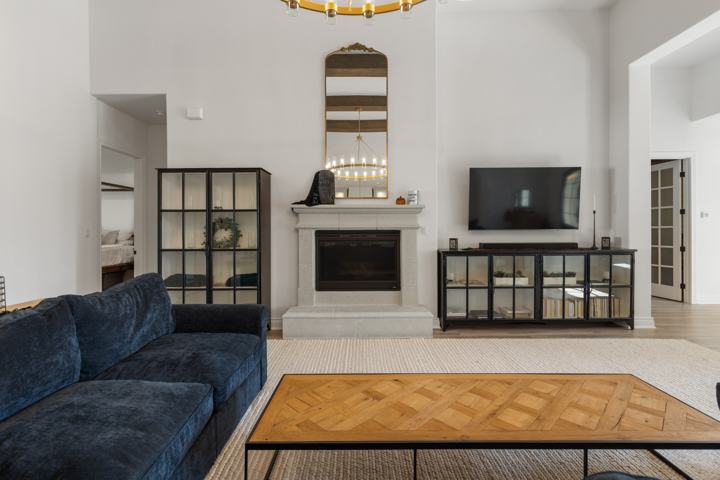 Fireplace wall with glass-front cabinets