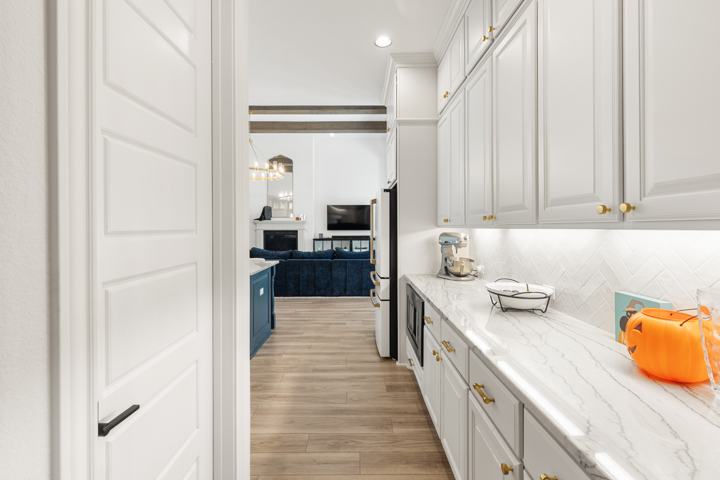 Kitchen toward the pantry and wall ovens
