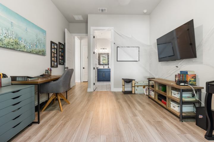 Bedroom with a desk and window