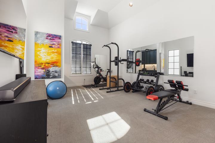 Home gym with high ceilings